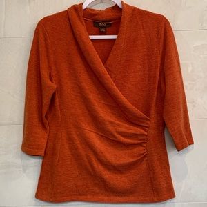 flattering burnt orange blouse, v neck with ruching on the side